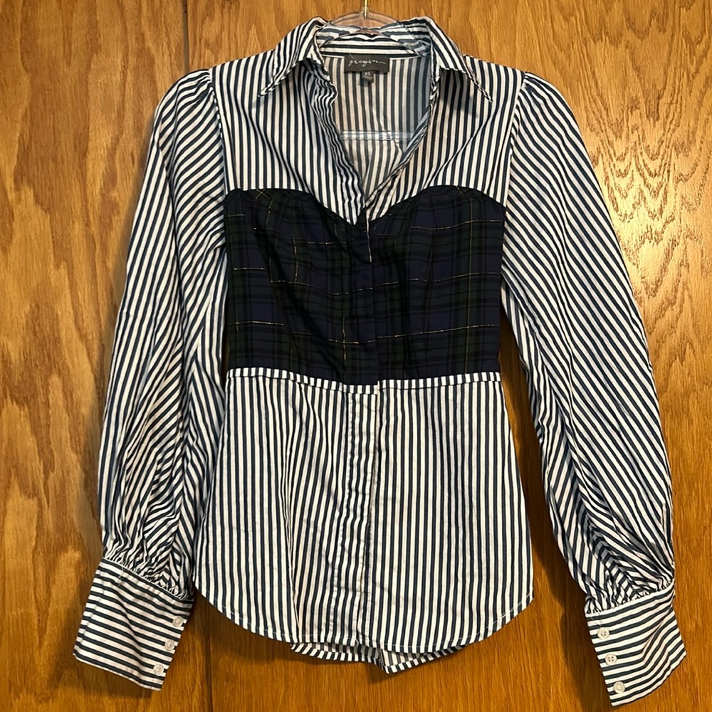 Blue and white striped shirt.